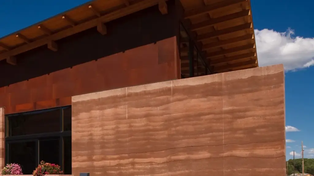 Rammed earth wall layers compacted in formwork (commissioned illustration, non-stock; no AD Studio 9 rammed earth project implied)