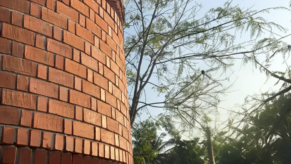 Rat trap bond brickwork: bricks on edge with an internal air cavity